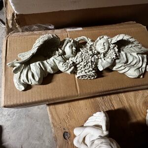 Cherub wall sculpture